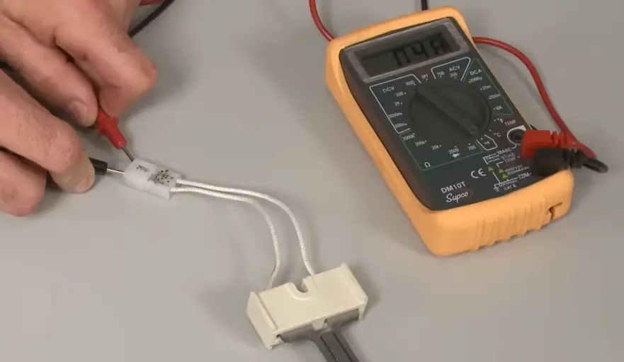 Dryer repair meter check Cedar Rapids - technician testing heating element continuity